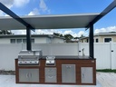 Outdoorkitchen 9 ft · Cinnamon Walnut · Bull Outlaw 30-Inch 4-Burner Built-In Propane Gas Grill - full view